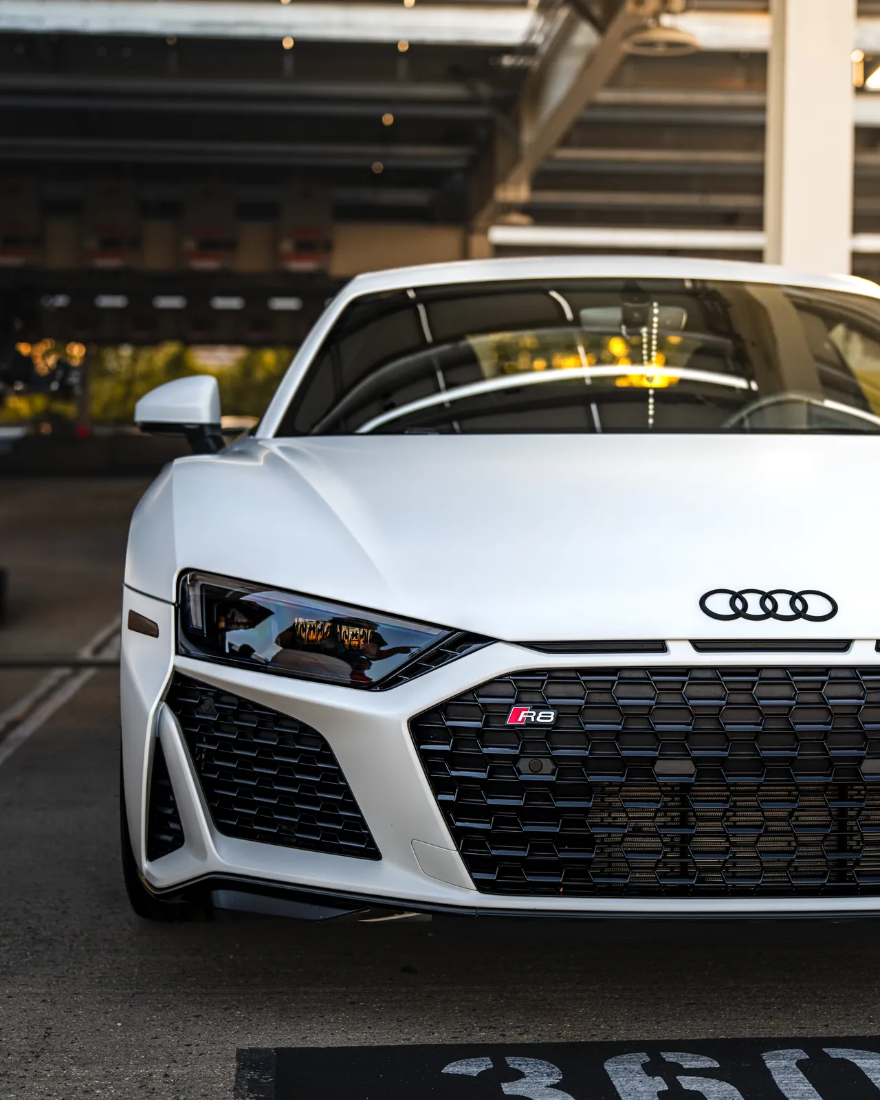 Close-up of front left half of White Audi R8