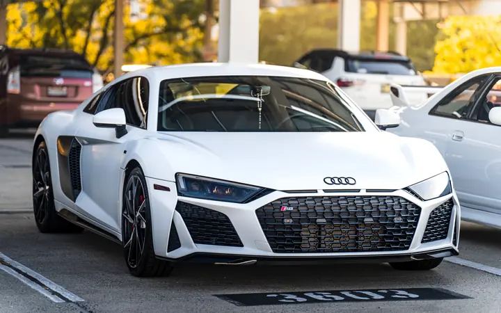 White Audi R8 in a parking garage